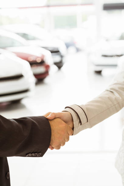 istock Salesman shaking a customer hand 665214416