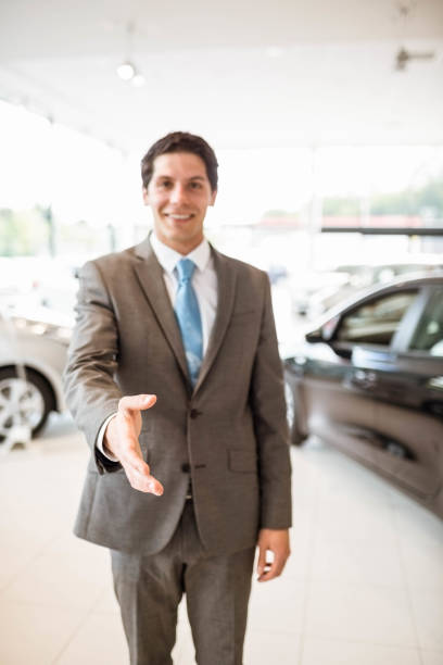 istock Smiling salesman ready to shake hand 665215302