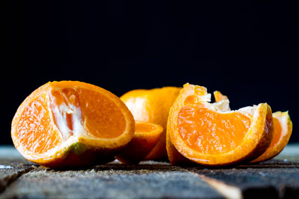 istock Mandarin and chocolate on an old wooden table in an old kitchen 665225476