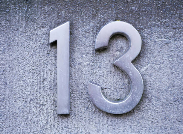 istock Number 13 on brick wall, background, rustic and grunge wall 665225828