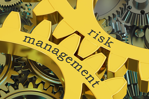 Risk Management concept on the gearwheels, 3D rendering