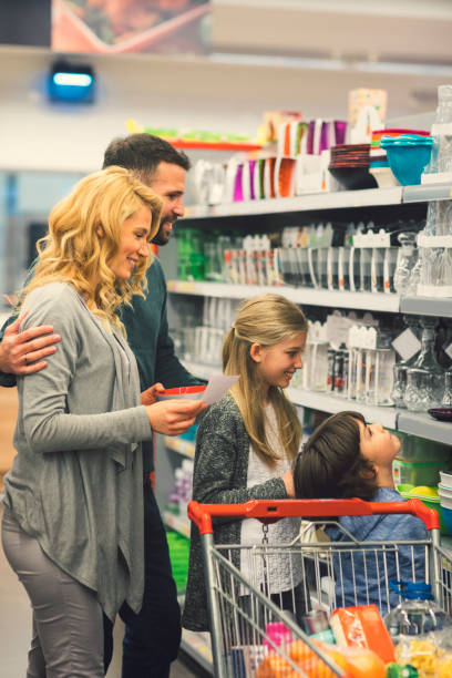 istock Family shopping in supermarket 665235708