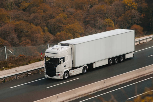 istock White truck on highway 665242082