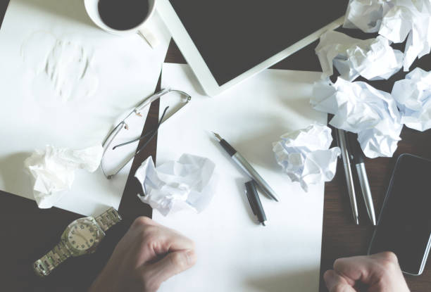 istock The Young male business entrepreneur has a problem with writing a business plan. 665242450