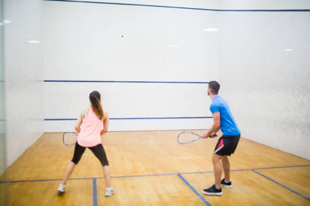 istock Couple play some squash together 665248374