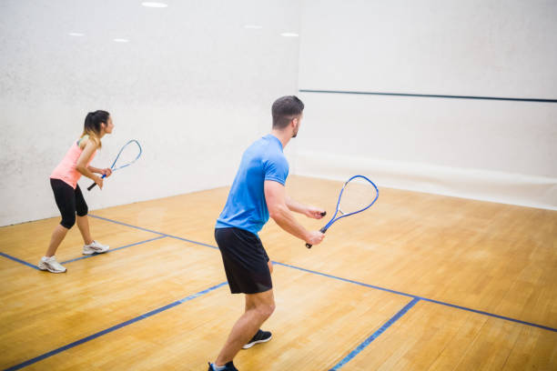 istock Couple enjoying a game of squash 665249270