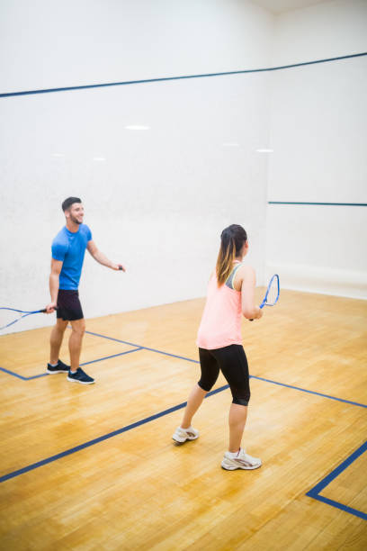 istock Couple playing a game of squash 665249652
