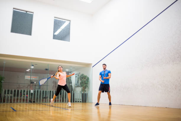 istock Couple playing a game of squash 665252022