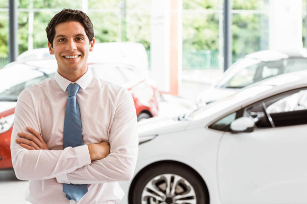 istock Smiling businessman standing with arms crossed 665256182