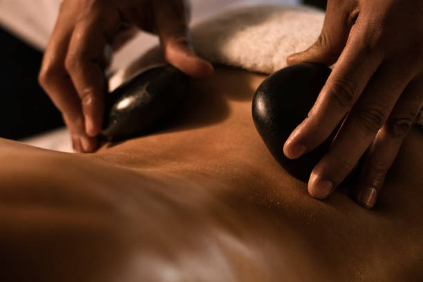 Stone massage closeup stock photo