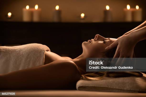 Young Woman Enjoys Massage In A Luxury Spa Resort Stock Photo - Download Image Now - Spa, Massaging, Luxury