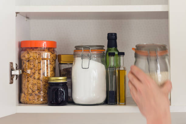 istock food cupboard with jars 665280394