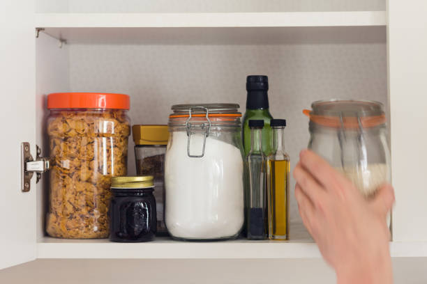 food cupboard with jars stock photo