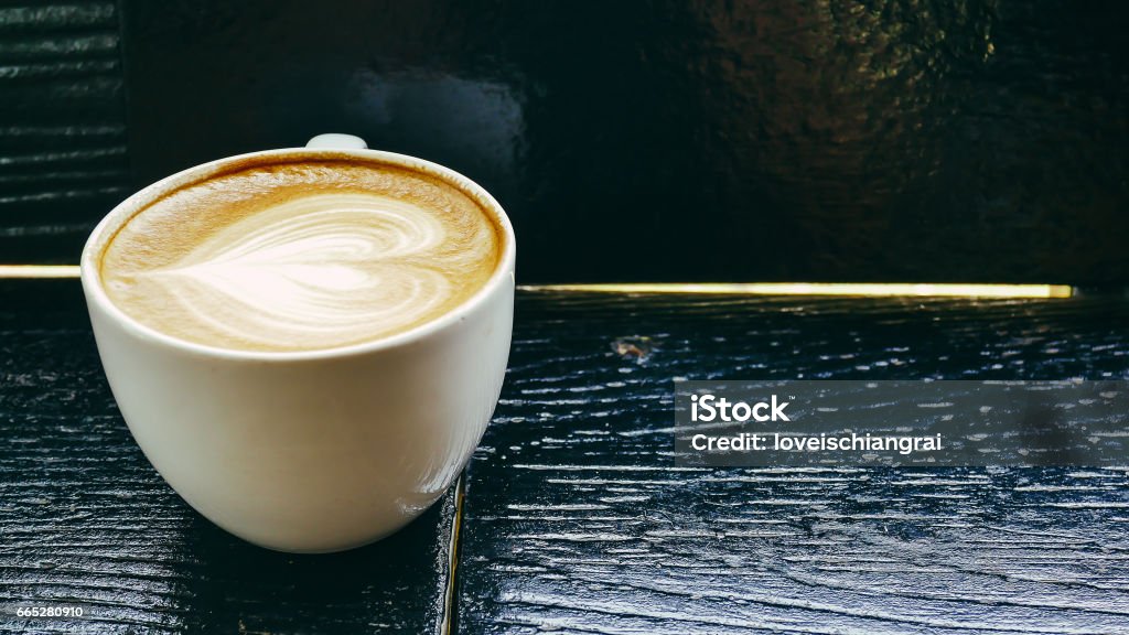 Coffee cup in coffee shop - vintage style effect picture Adulation Stock Photo