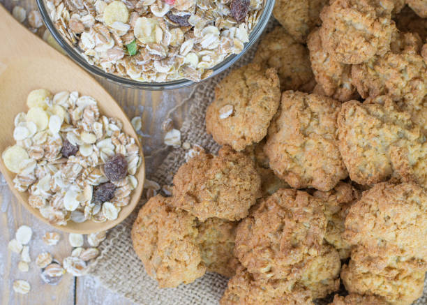 istock Freshly made biscuits with cereals on a rustic wooden table. 665284096