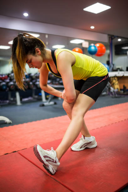istock Woman massaging her injured leg 665287794