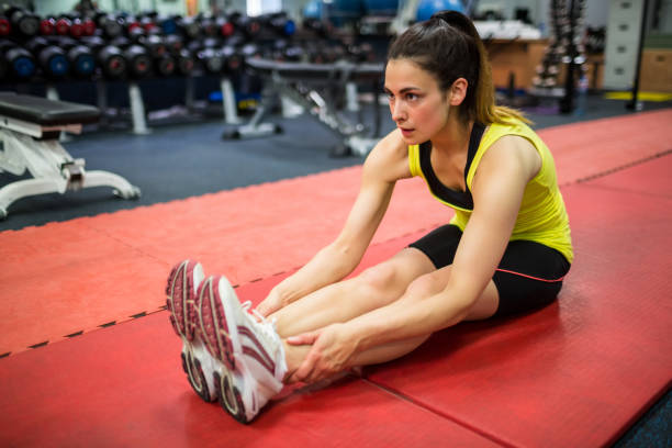 istock Woman doing warm up exercises 665287842