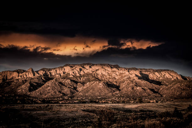 istock Sandia Mountains with ominous, dramatic, towering clouds. 665298360