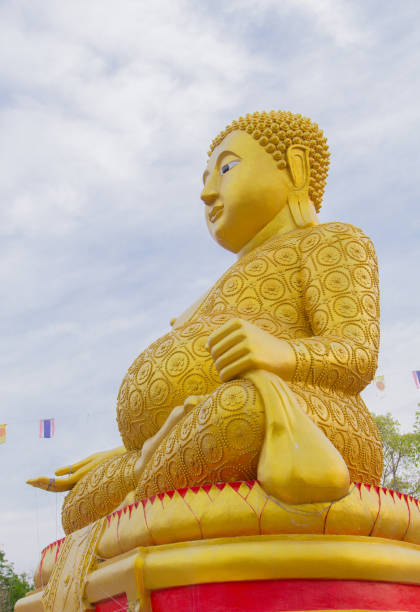 istock Big Buddha statue over scenic white and blue sky . 665304872