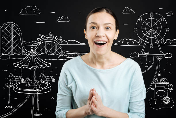 istock Joyful woman resting in the amusement park 665305312