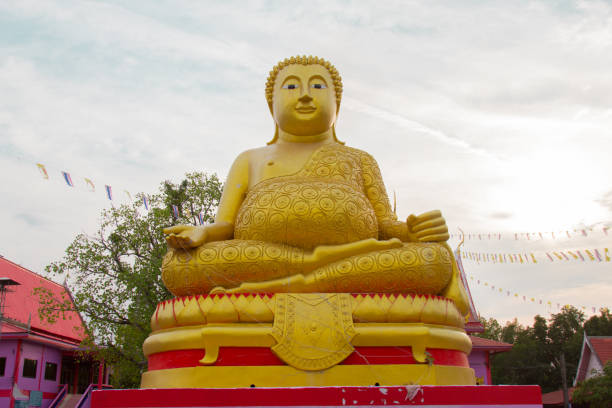istock Big Golden Buddha statue over scenic white and blue sky. 665305368