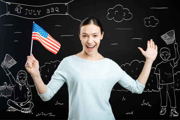 istock Cheerful woman celebrating independence day 665305674