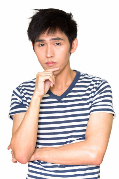 istock Studio shot of young handsome Asian man thinking isolated against white background 665308674