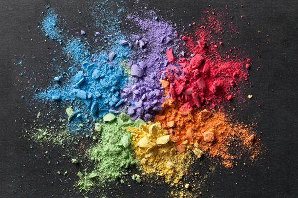 Colorful background of chalk powder Broken pastel particles on a blackboard. pastel crayon photos stock pictures, royalty-free photos & images