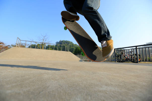 istock young skateboarder legs skateboarding at skatepark 665312474