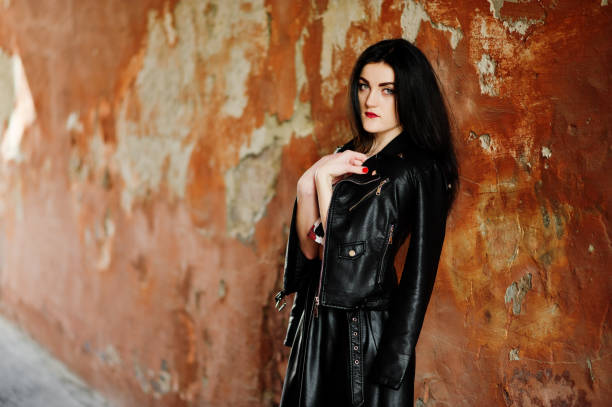 istock Young goth girl on black leather skirt 665321864