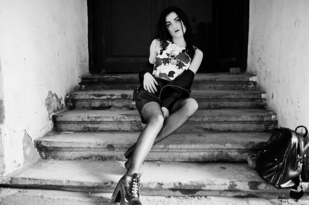 istock Young goth girl on black leather skirt 665322826