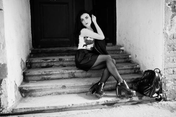 istock Young goth girl on black leather skirt 665322940