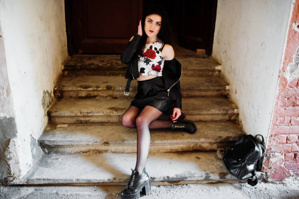 istock Young goth girl on black leather skirt 665322972