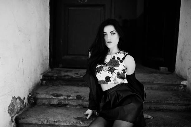 istock Young goth girl on black leather skirt 665323092