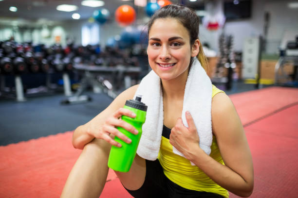 istock Woman drinking from her sports bottle 665323566