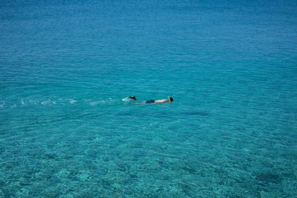 istock Man swimming at Mediterranean sea 665323842