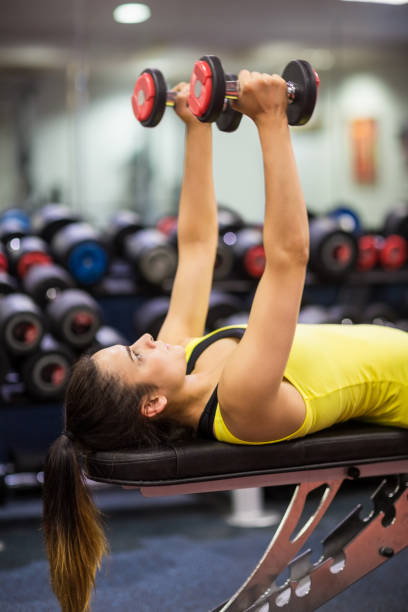 istock Woman working out with weights 665326852