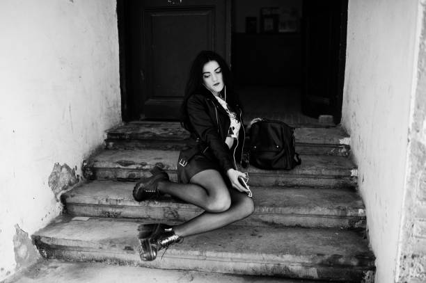 istock Young goth girl on black leather skirt, 665334080