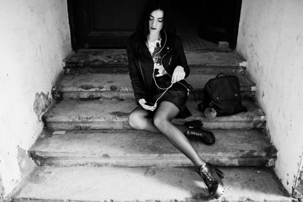 istock Young goth girl on black leather skirt, 665334090