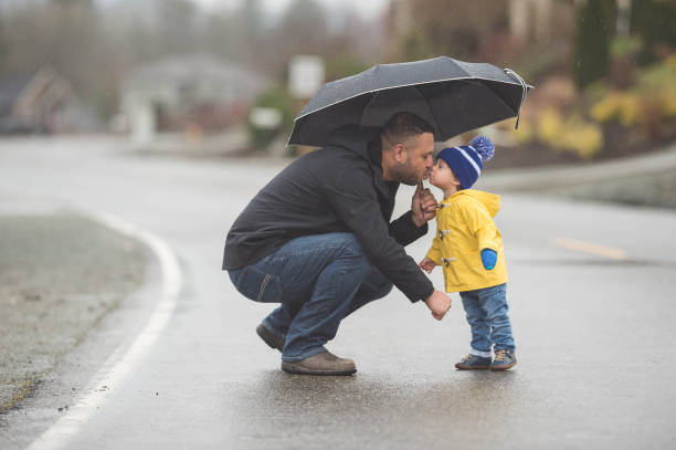 istock Family Walk in the Rain 665334224