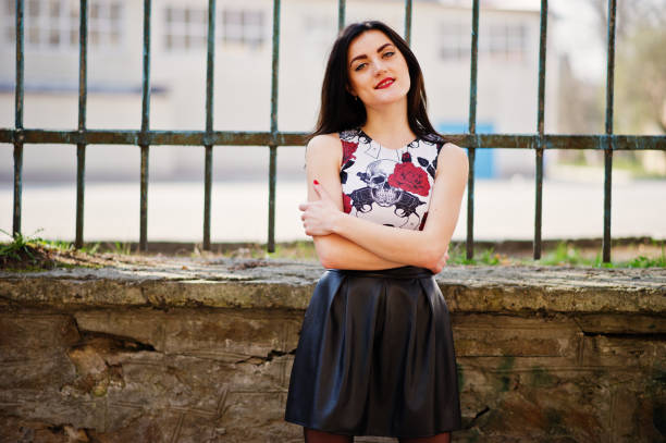 istock Young goth girl on black leather skirt, 665336436