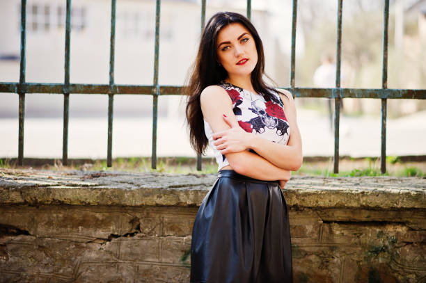 istock Young goth girl on black leather skirt, 665336466
