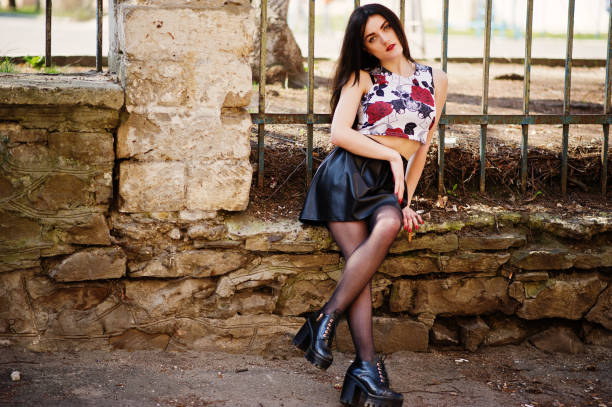 istock Young goth girl on black leather skirt, 665336668