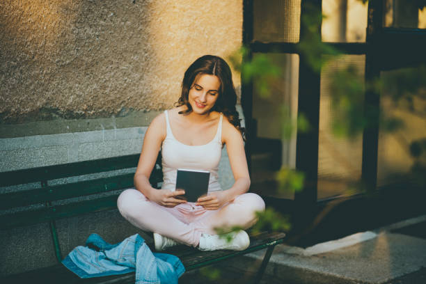 istock teenager girl using tablet 665338238