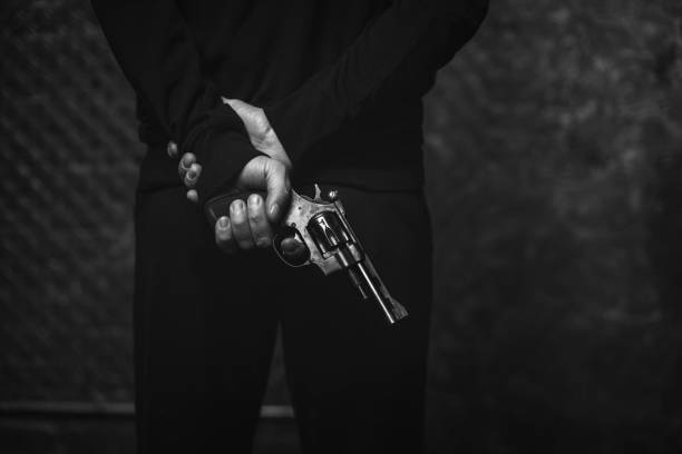 istock Wicked antagonized felon hiding a weapon 665340678