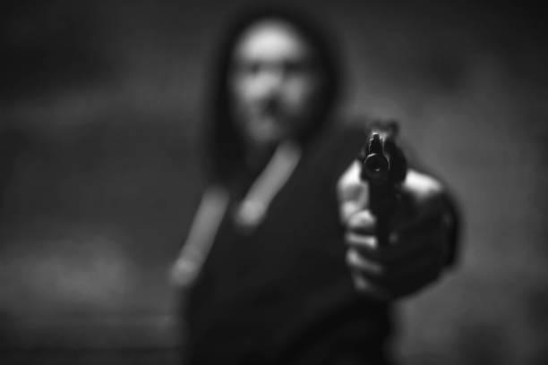 Loaded wicked criminal pulling a gun on somebody You better comply. Monstrous senseless evil man pointing a weapon on his victim trying scaring her for robbery armory photos stock pictures, royalty-free photos & images