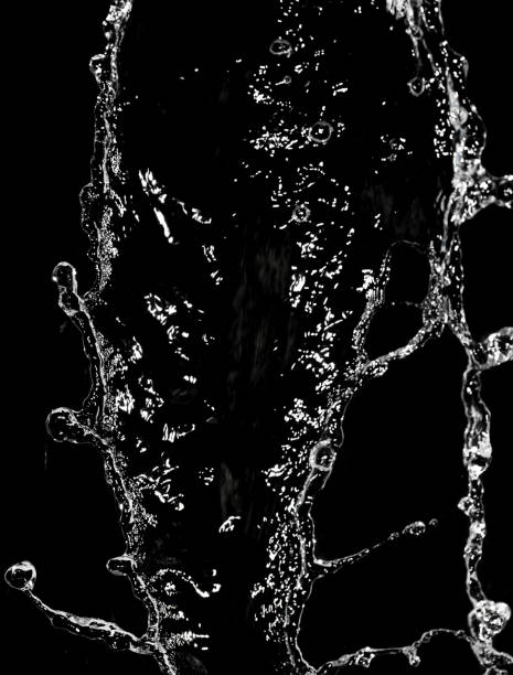 istock stream of water on a black background 665345370