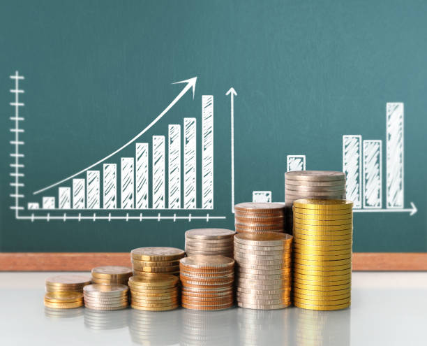 istock Coins graph stock market 665345542