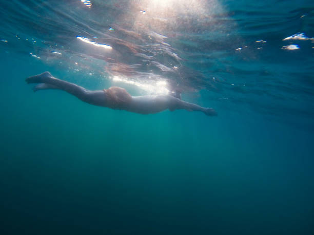 istock Man swimming in the sea 665348518
