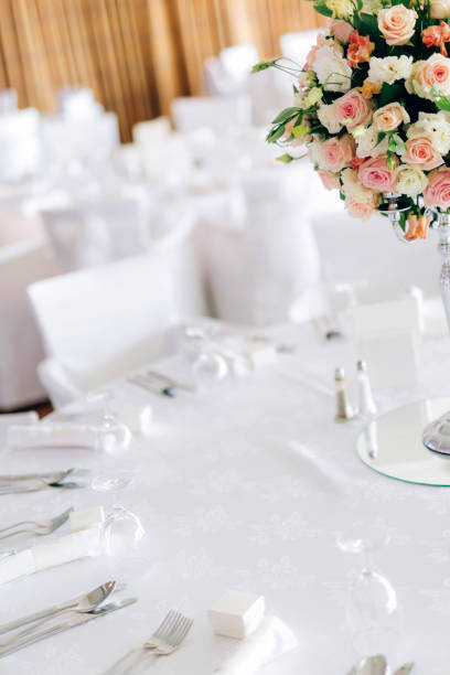 istock Beautiful decoration on wedding table with roses in bouquet 665353154